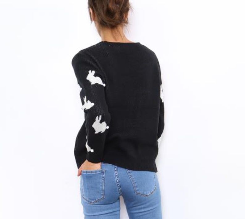 black pullover with white bunnies